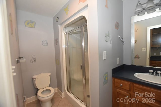 full bathroom featuring vanity, toilet, a shower stall, and tile patterned flooring