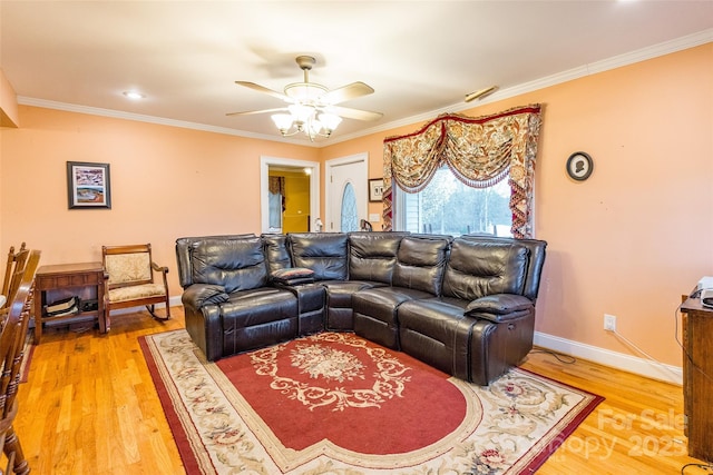 living room featuring light wood-type flooring and ornamental molding