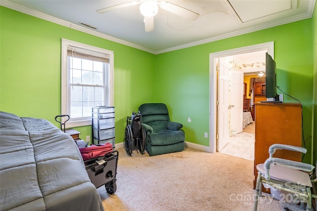 carpeted bedroom featuring visible vents, a ceiling fan, crown molding, and baseboards