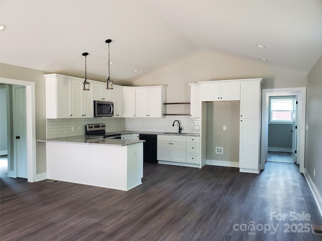 kitchen with a sink, appliances with stainless steel finishes, a peninsula, and white cabinets