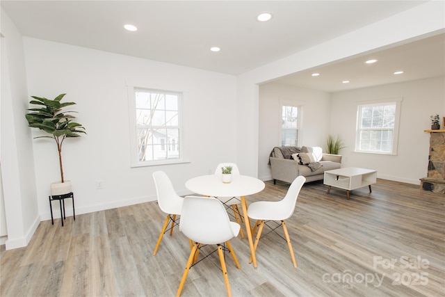 dining space with recessed lighting, baseboards, and light wood-style floors