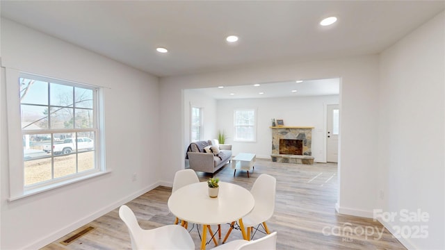 sitting room with recessed lighting, visible vents, light wood-style floors, and a healthy amount of sunlight