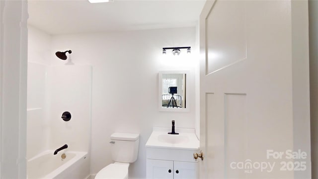 full bathroom featuring toilet, tub / shower combination, and vanity