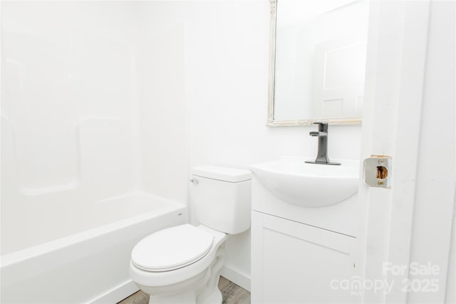 full bathroom featuring toilet and vanity