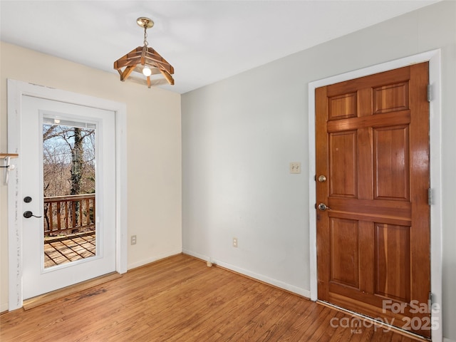 entryway featuring light wood-type flooring and baseboards