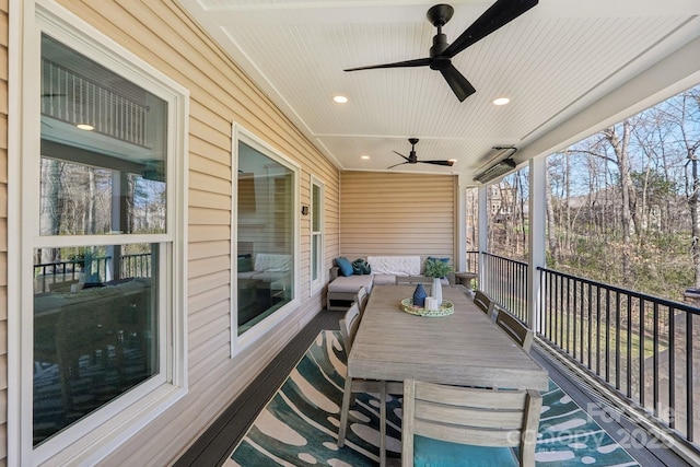 wooden terrace featuring a ceiling fan