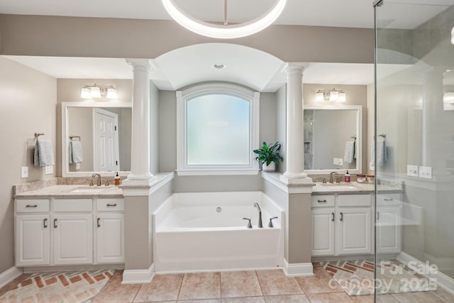 full bath with a sink and ornate columns