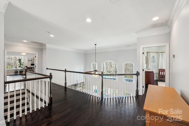 hallway featuring an upstairs landing, visible vents, recessed lighting, and wood finished floors