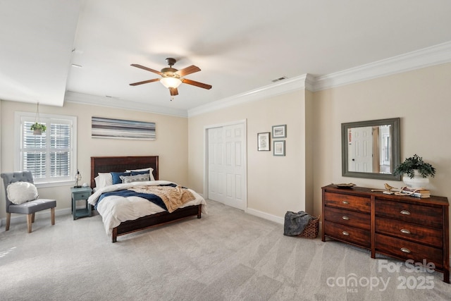 bedroom with crown molding, baseboards, carpet floors, and ceiling fan