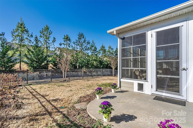 view of yard featuring a patio area and fence