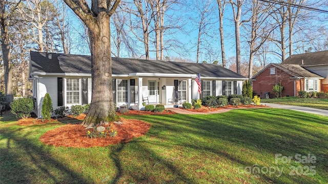 ranch-style home with a front lawn