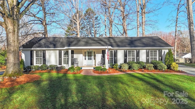 single story home with stucco siding, a porch, and a front lawn