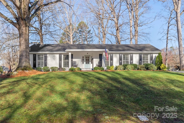 ranch-style house with a front yard and stucco siding