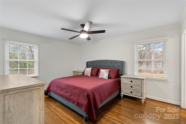 bedroom featuring dark wood-type flooring, multiple windows, and ornamental molding