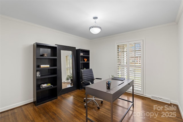 office with visible vents, baseboards, dark wood-style flooring, and crown molding