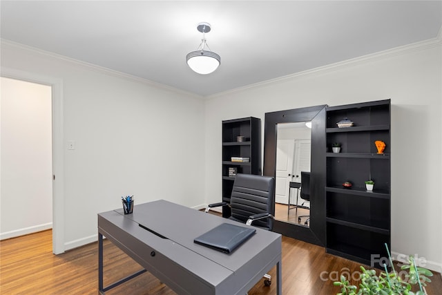 office with baseboards, wood finished floors, and ornamental molding