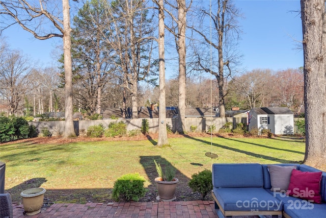 view of yard featuring an outbuilding and fence