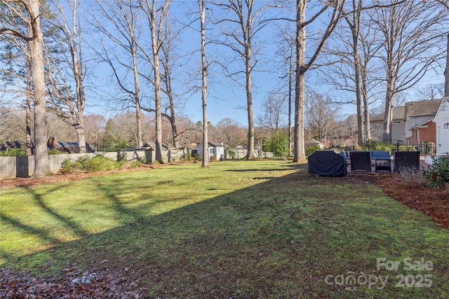 view of yard featuring fence