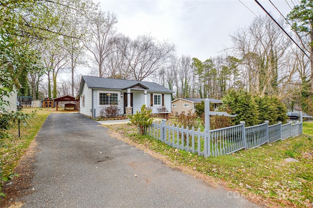 bungalow-style house with a fenced front yard