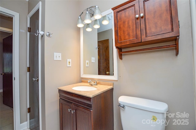 bathroom with toilet and vanity