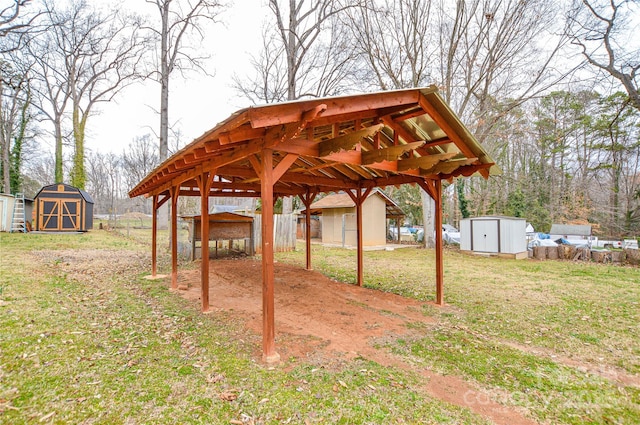 view of yard featuring an outbuilding, a storage shed, and fence