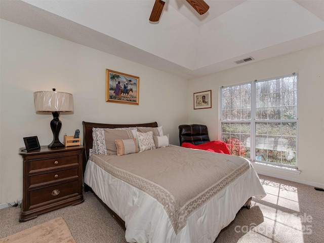 bedroom featuring a ceiling fan, baseboards, visible vents, lofted ceiling, and light carpet