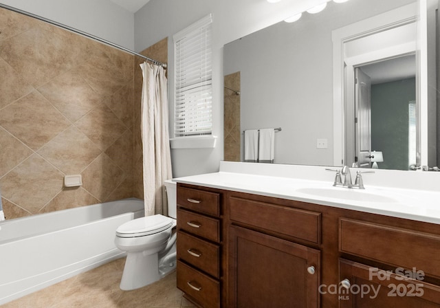 full bath featuring tile patterned floors, shower / bath combo with shower curtain, toilet, and vanity