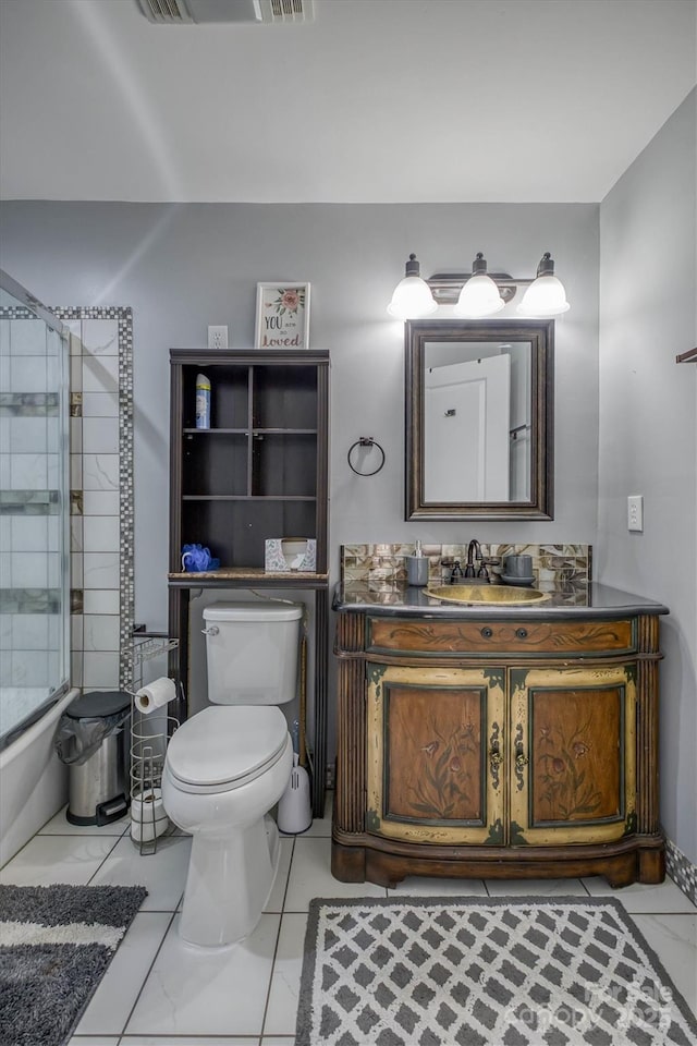 full bath with a shower with door, marble finish floor, toilet, and vanity