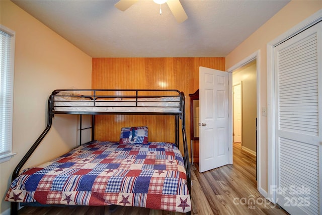 bedroom with wood finished floors and ceiling fan