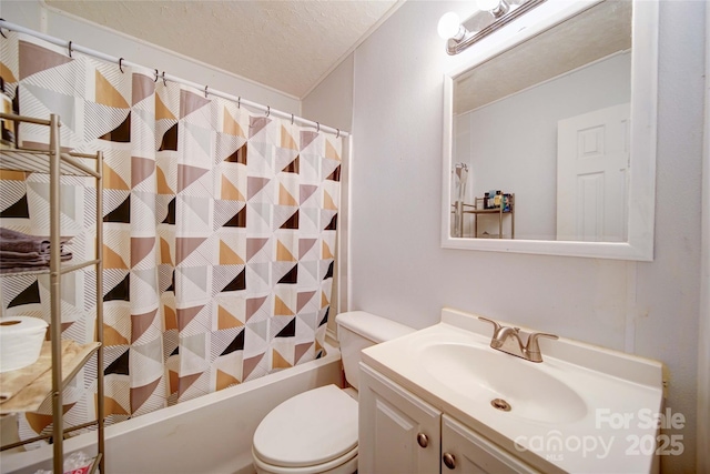 bathroom with vanity, toilet, shower / bath combo with shower curtain, and a textured ceiling