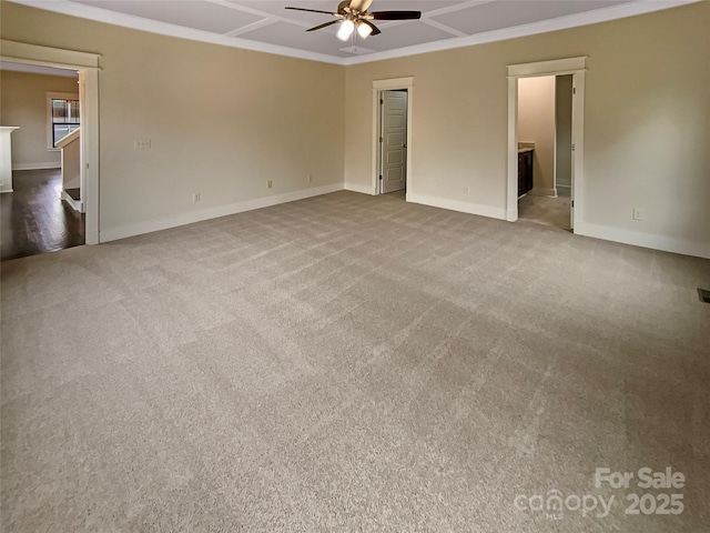 unfurnished bedroom with crown molding, carpet flooring, baseboards, and coffered ceiling