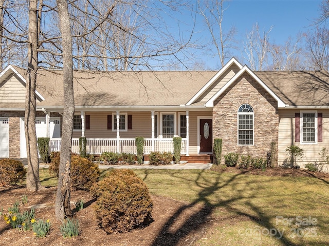 single story home with covered porch, a shingled roof, a front lawn, a garage, and stone siding