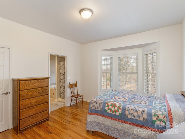 bedroom featuring light wood-style flooring