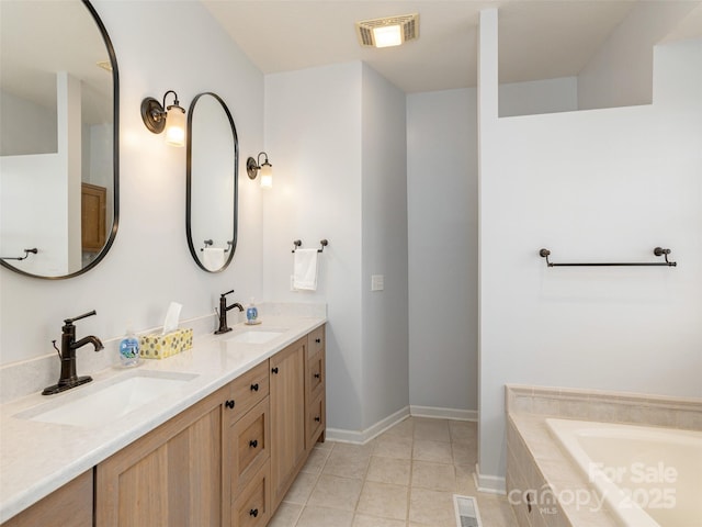 bathroom with double vanity, visible vents, and a sink