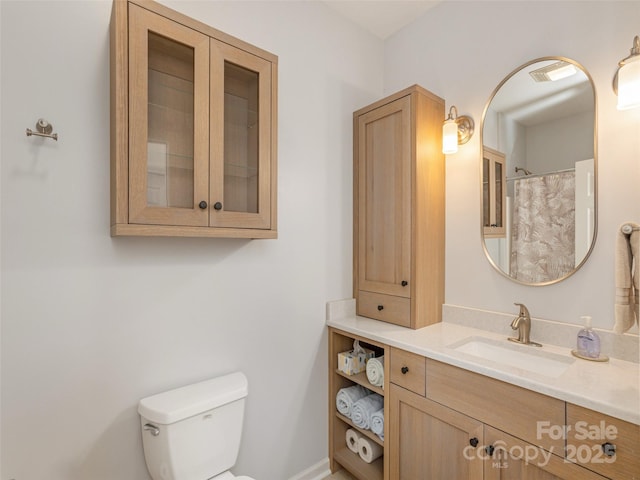 full bath with vanity and toilet