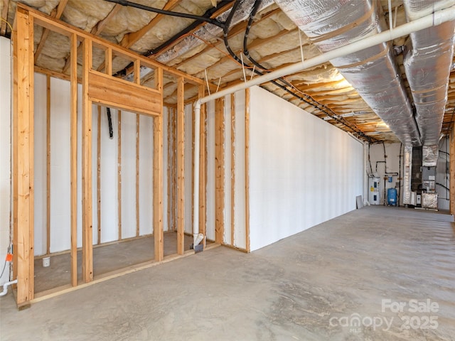 unfinished basement featuring heating unit