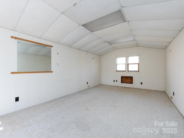 bonus room with lofted ceiling and carpet