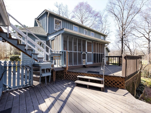 wooden terrace with stairs and a sunroom