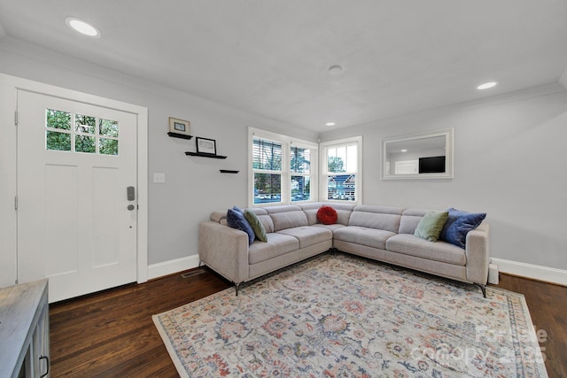 living area with recessed lighting, baseboards, and dark wood-style flooring