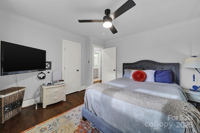 bedroom with a ceiling fan, wood finished floors, and baseboards