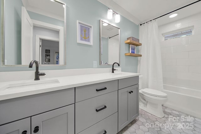 full bathroom with tile patterned flooring, toilet, shower / bath combo with shower curtain, and a sink