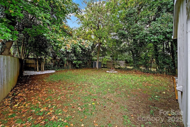 view of yard with a fenced backyard