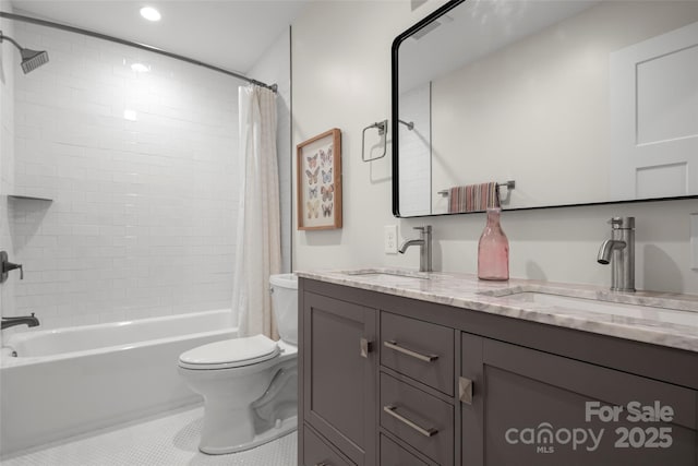 full bathroom featuring tile patterned flooring, toilet, shower / bath combo, and a sink