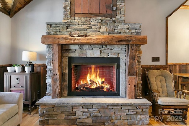 details with a fireplace and wood finished floors