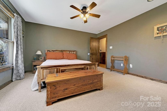 bedroom featuring a ceiling fan, baseboards, and carpet floors