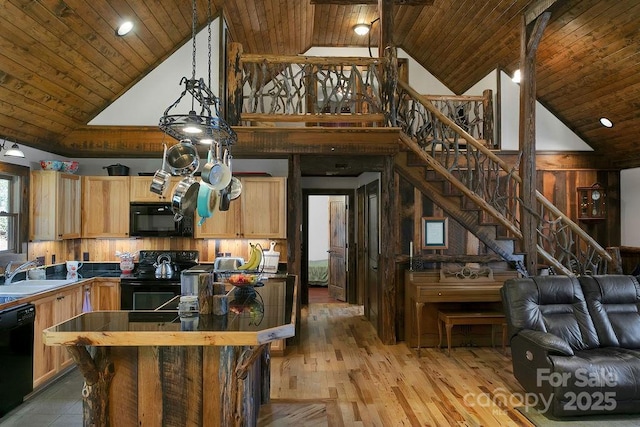 kitchen featuring light wood-style flooring, light brown cabinetry, a sink, black appliances, and wooden ceiling