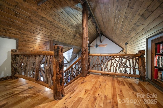 staircase featuring hardwood / wood-style floors, lofted ceiling, and wood ceiling