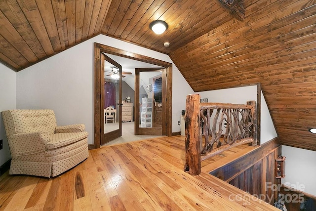 interior space featuring vaulted ceiling, wooden ceiling, and hardwood / wood-style flooring