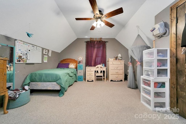 bedroom featuring vaulted ceiling, carpet flooring, and a ceiling fan