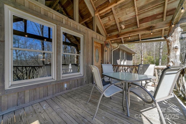 unfurnished sunroom with vaulted ceiling